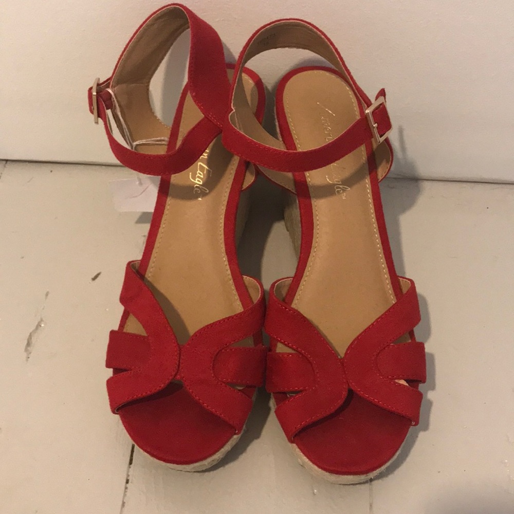 Never worn. Red wedge heels